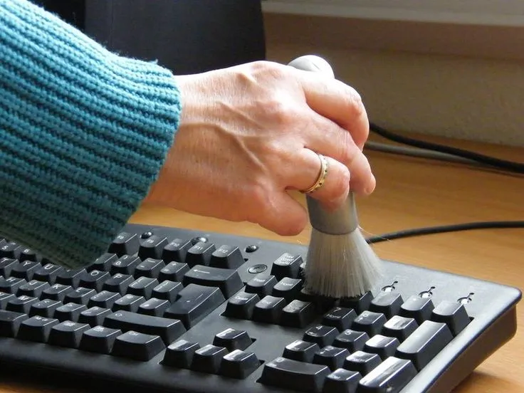 Use a soft brush to clean keyboard