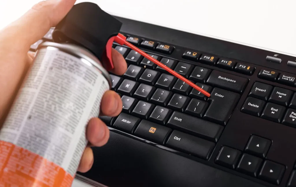 Use compressed air to clean keyboard